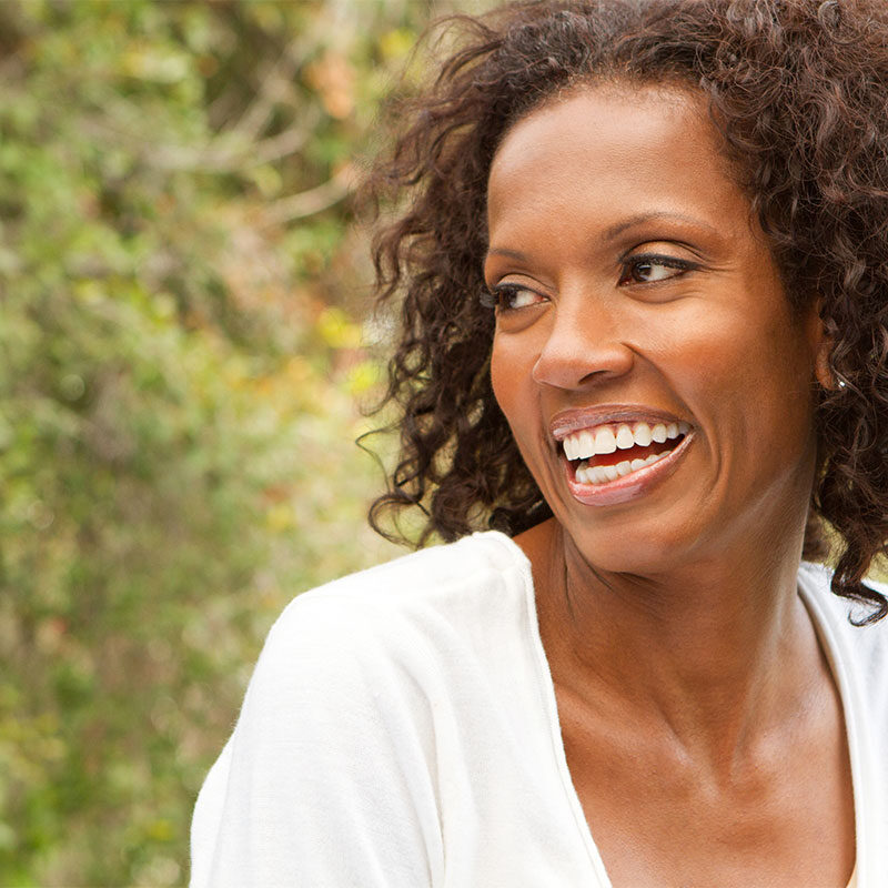 Beautiful older woman smiling after receiving female hormone replacement therapy in Virginia Beach, VA