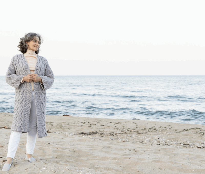 Woman considering HRT and age on beach in Virginia