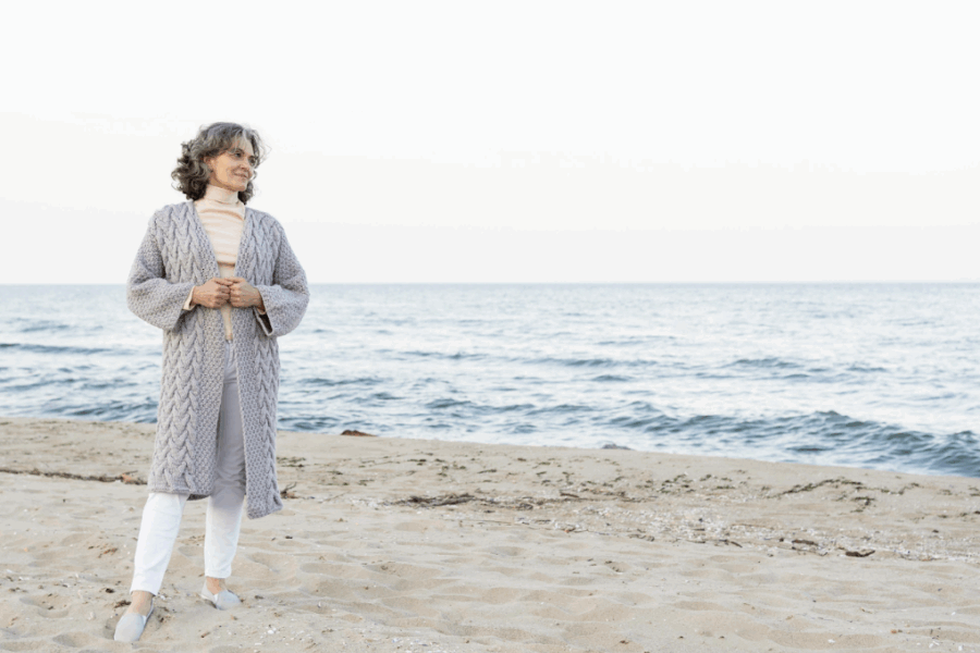 Woman considering HRT and age on beach in Virginia