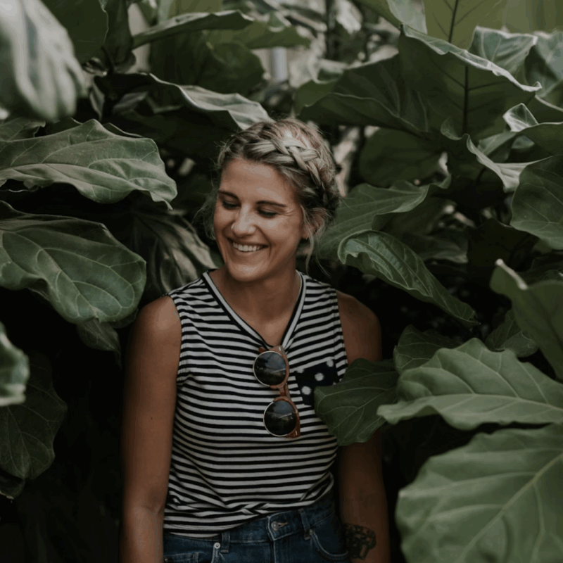 Happy woman in leafy surroundings