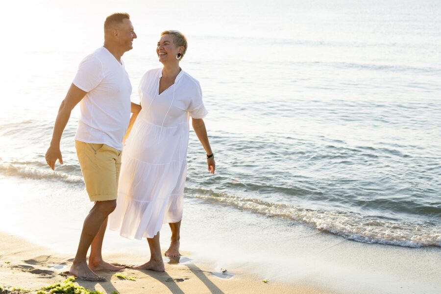 Couple walking along the beach