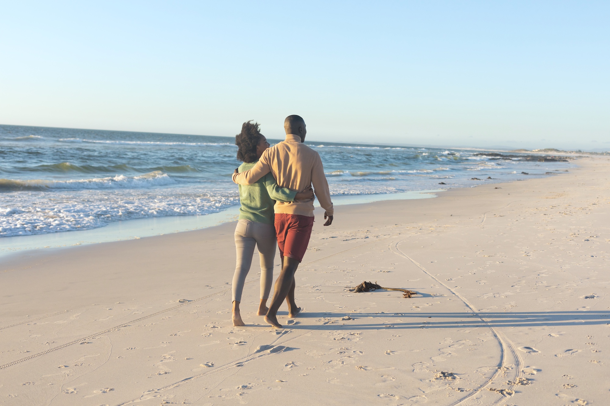 Couple walking along the beach
