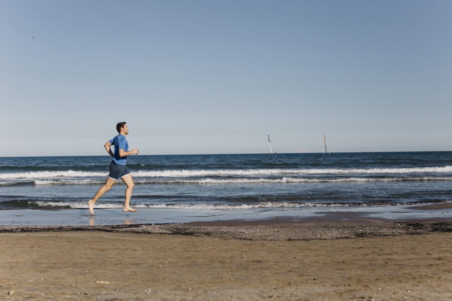 man exercising at the beach