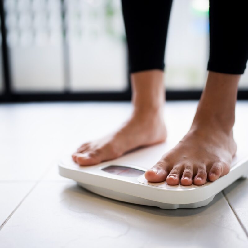 Woman standing on a scale