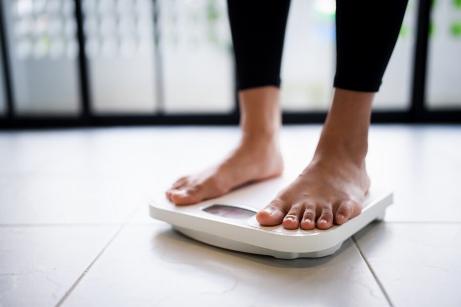 Woman standing on a scale