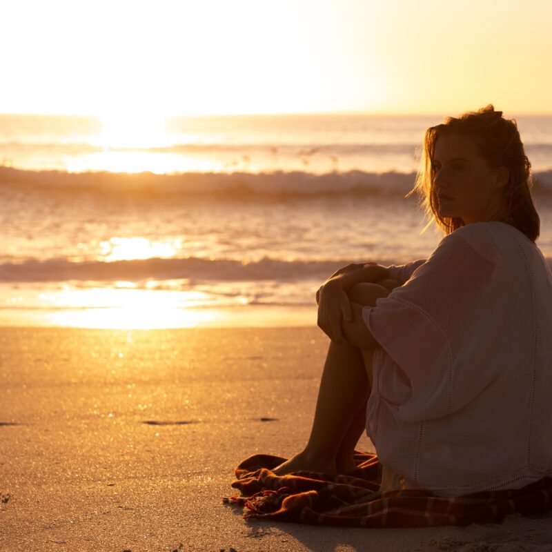 woman on the beach at sunset