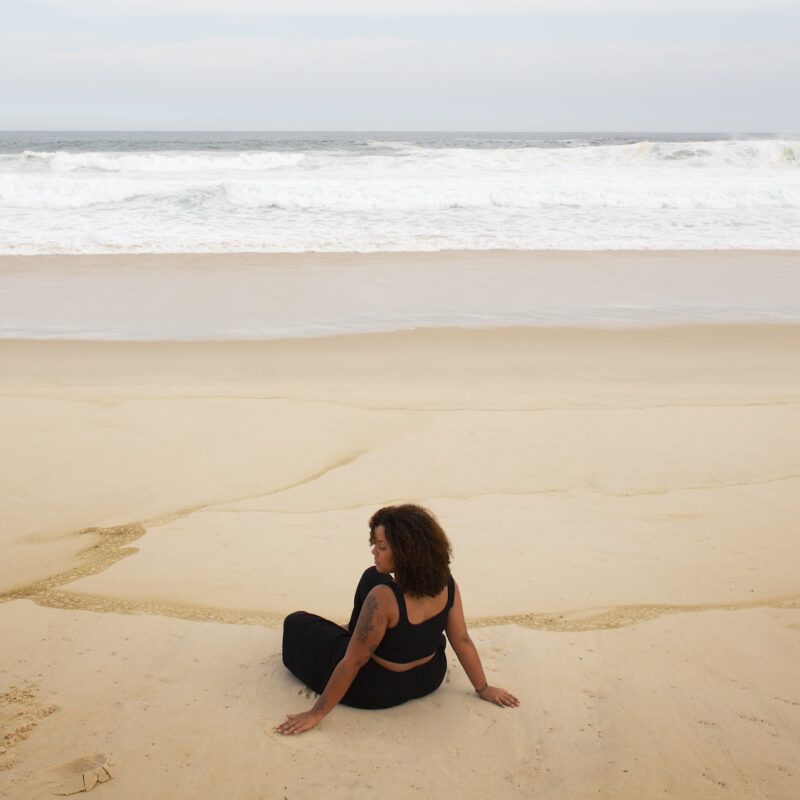 Woman thinking at the beach