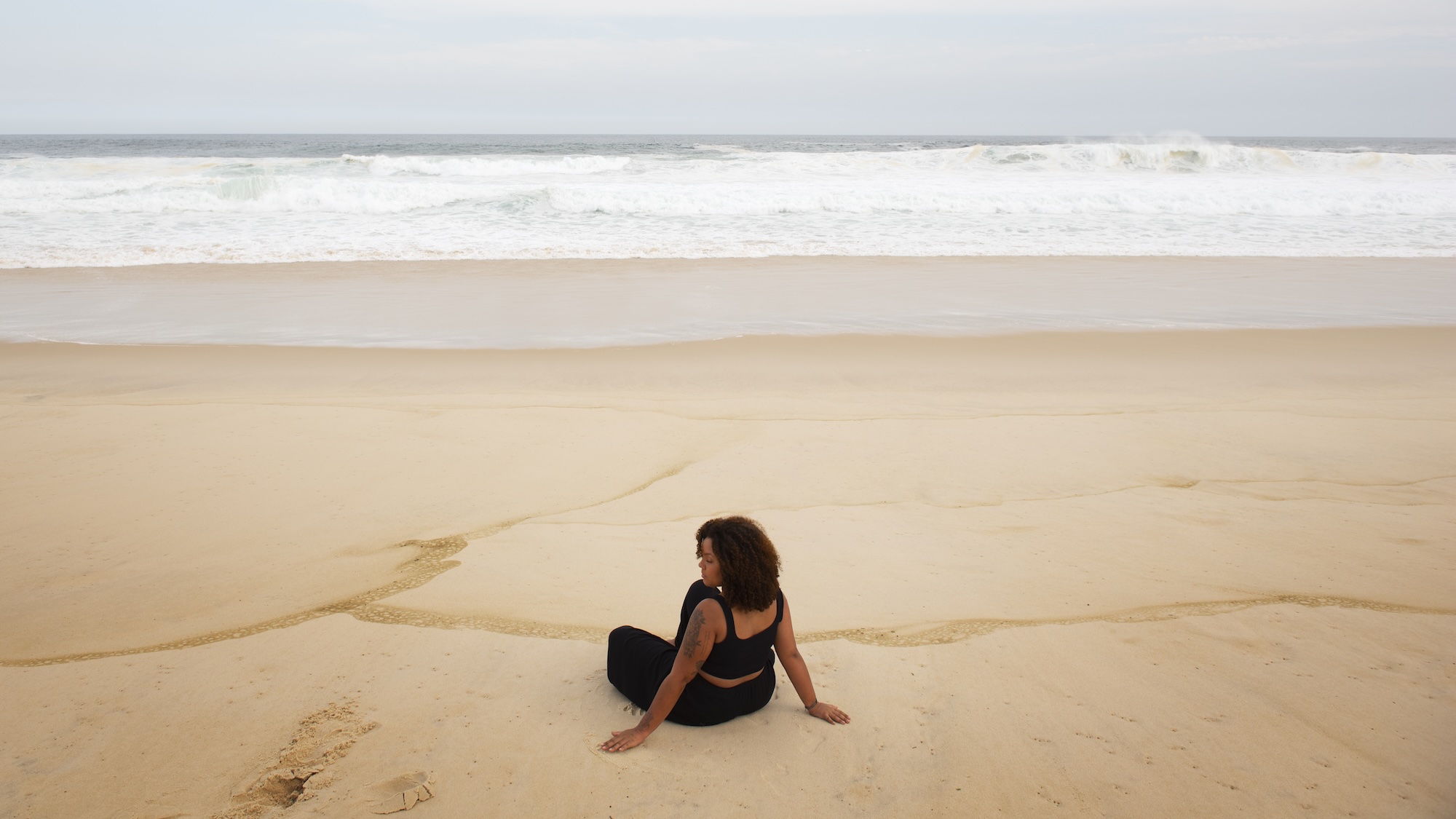 Woman thinking at the beach